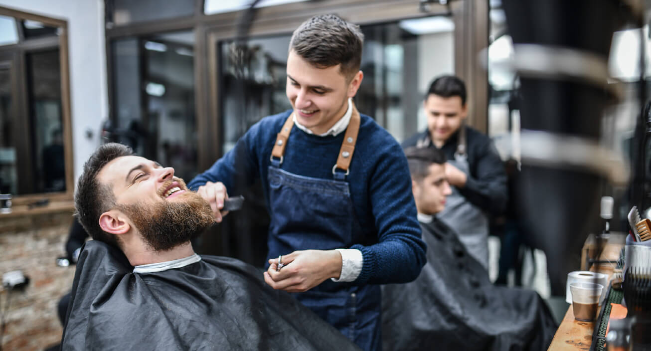 A young man decides to get a haircut by a beauty student after wondering how to save money in college.