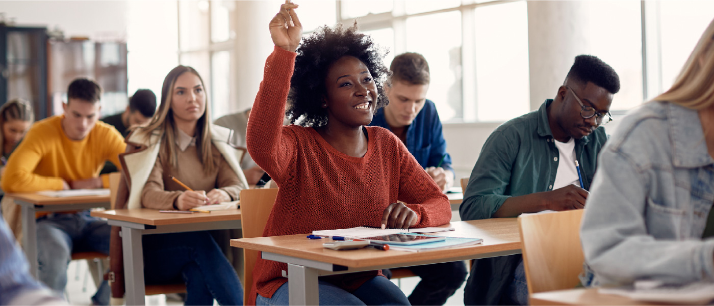 A young student enjoys class because she’s mastered how to save money in college.