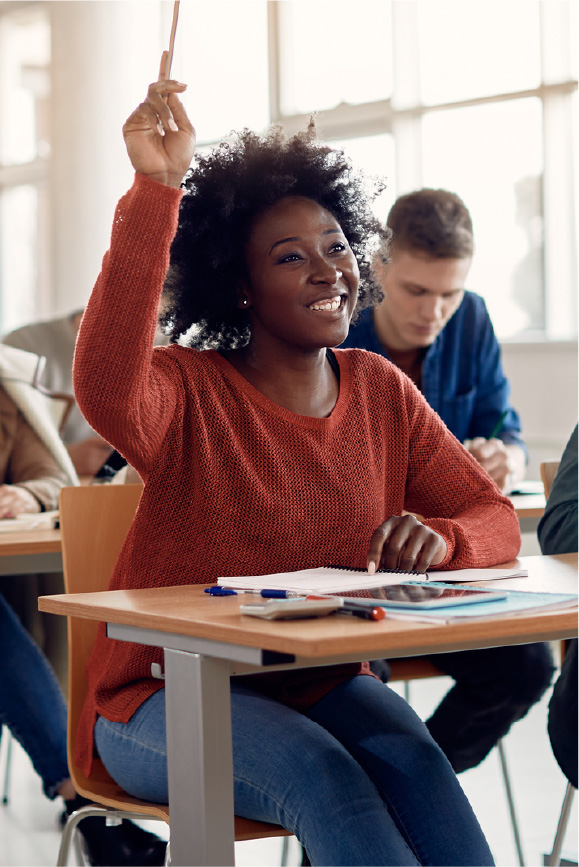 A young student enjoys class because she’s mastered how to save money in college.