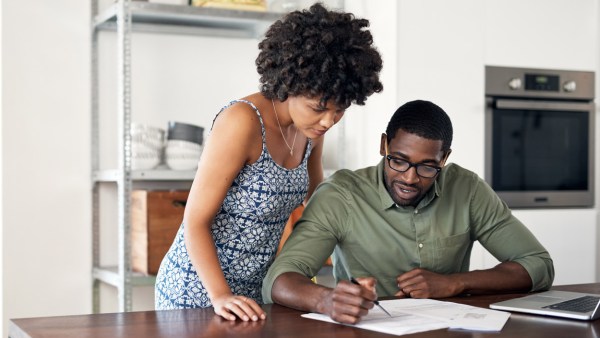 Couple looking over financial documents together