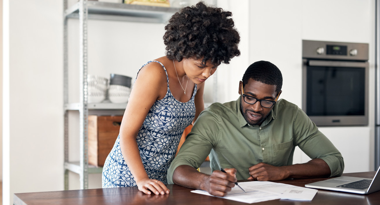 Couple looking over financial documents together