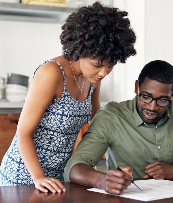 Couple looking over financial documents together