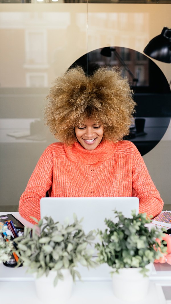 Woman using laptop in office