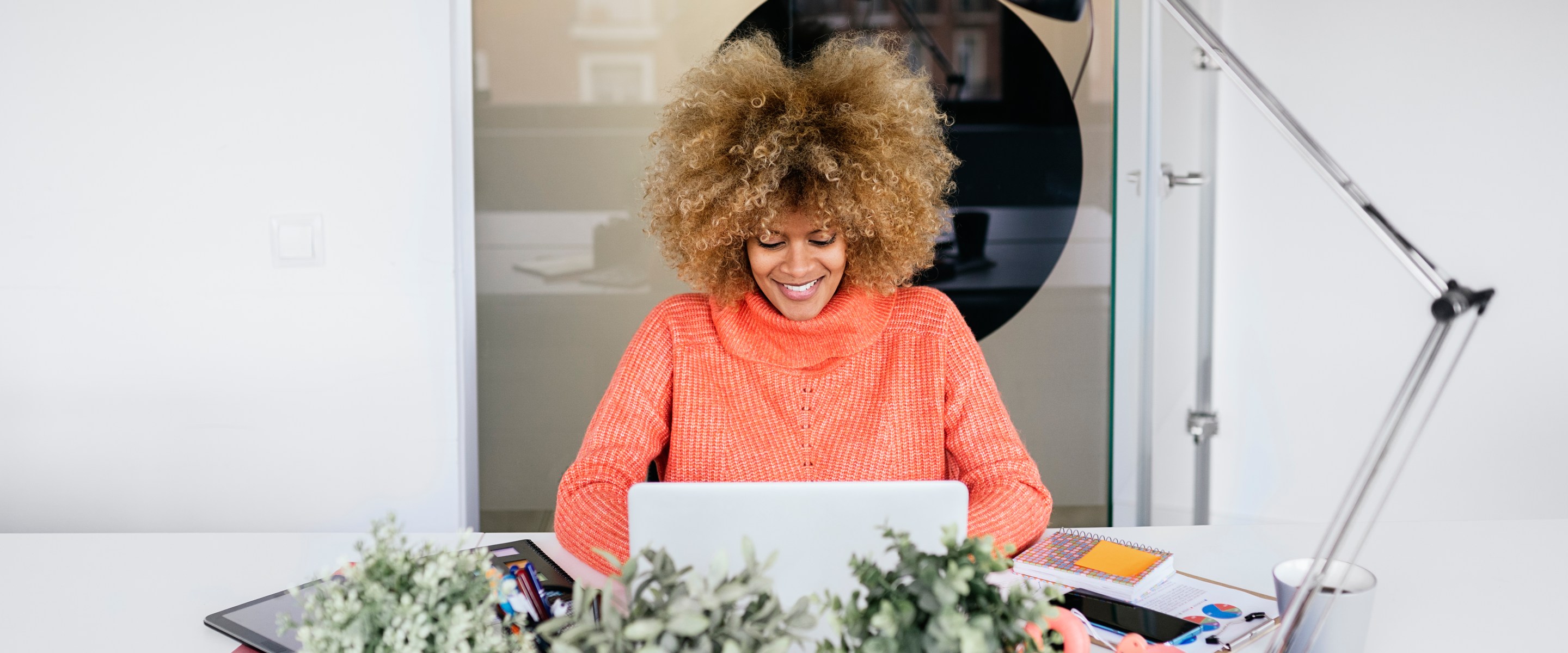 Woman using laptop in office