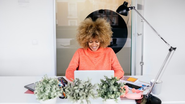 Woman using laptop in office