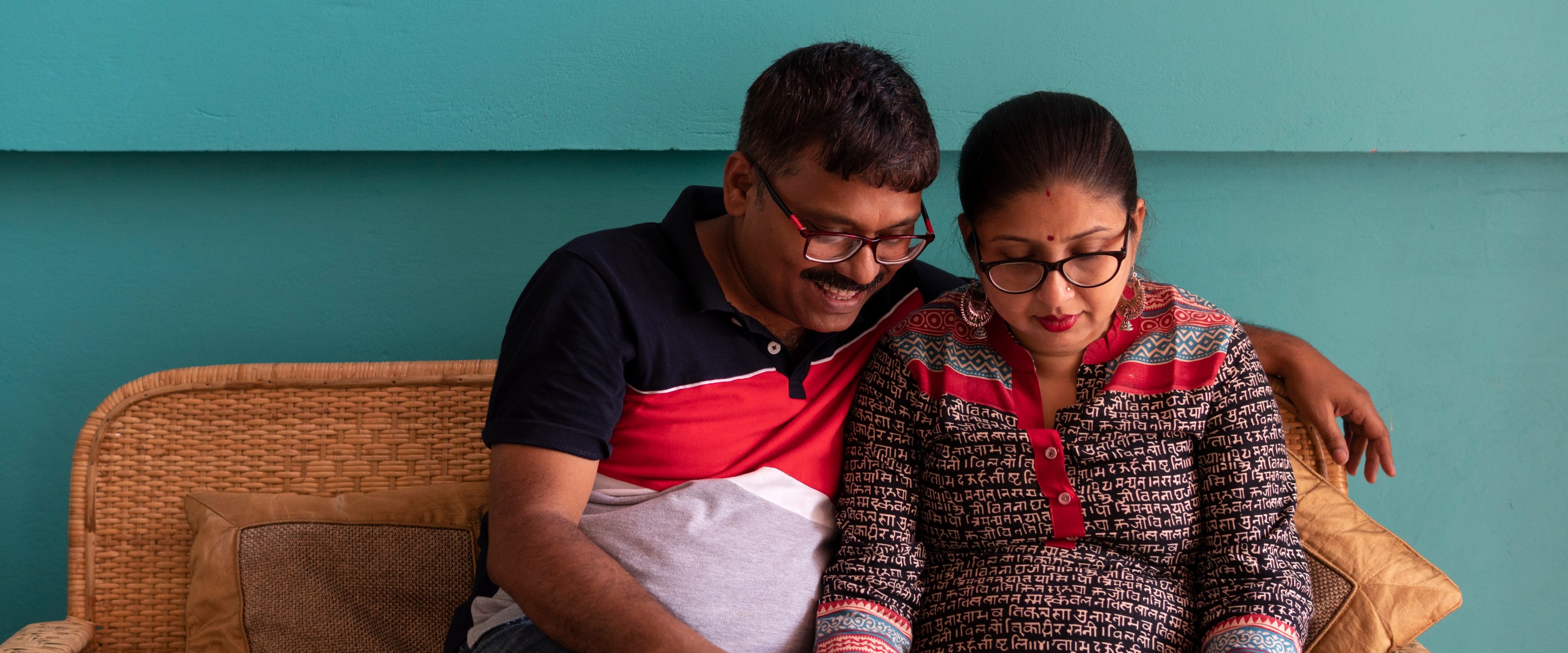 Indian Couple With Laptop Inside Room