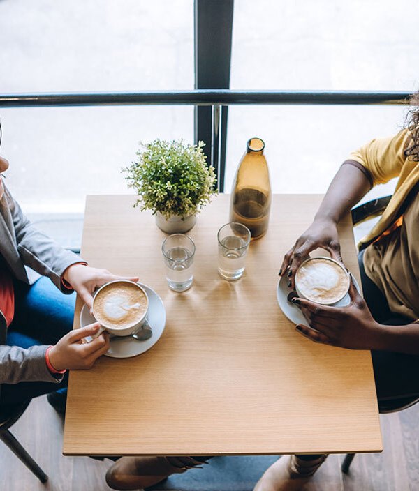 two-ladies-talking-over-coffee