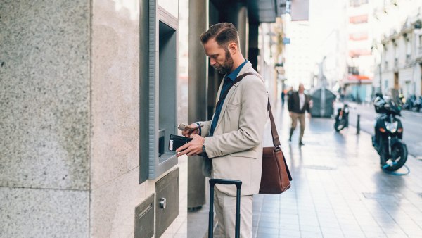 man-depositing-cash-at-an-atm