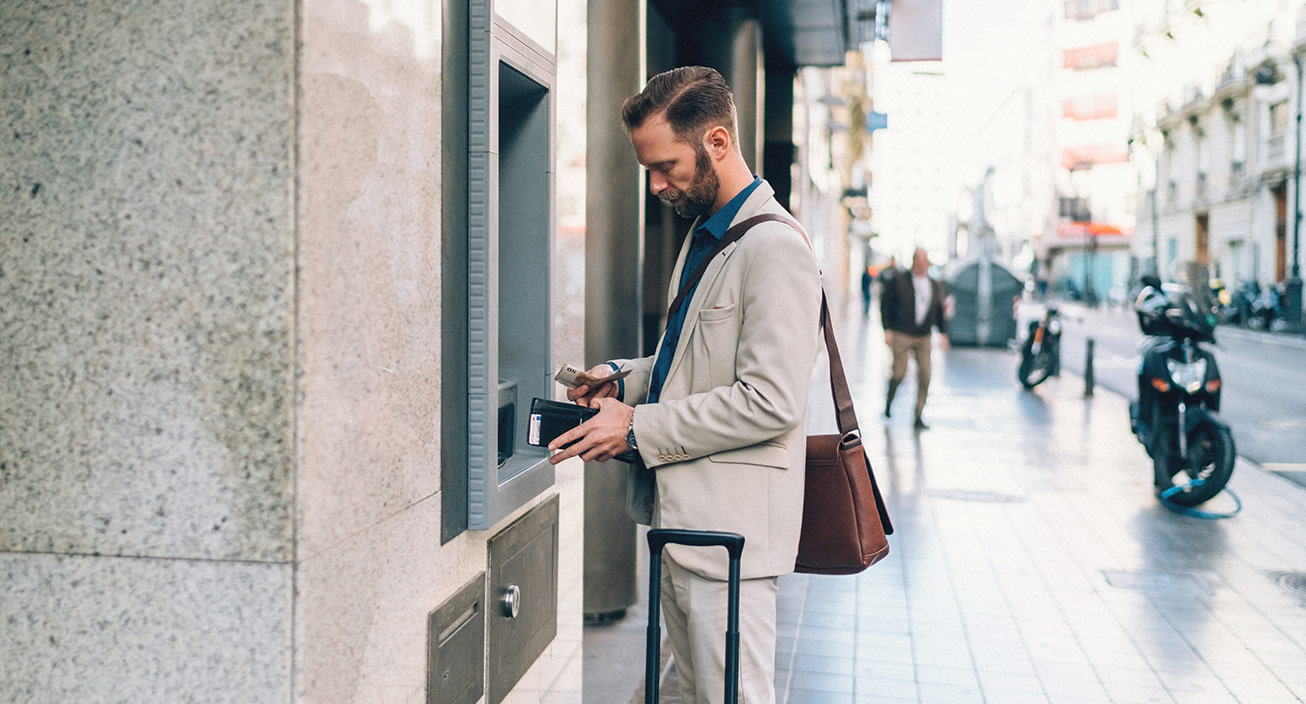 man-depositing-cash-at-an-atm