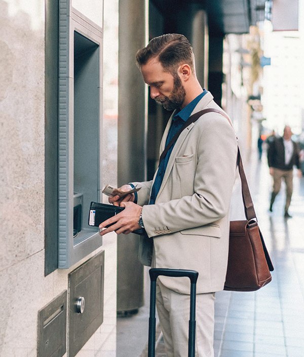 man-depositing-cash-at-an-atm