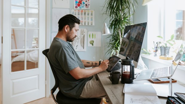 designer-working-computer-workspace-artist