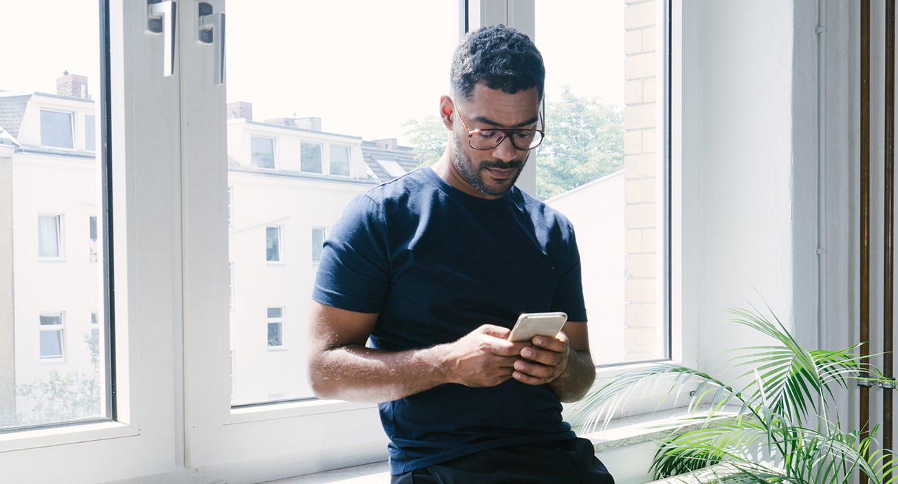 man looking at phone