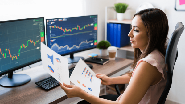 business woman analyzing stocks data at home