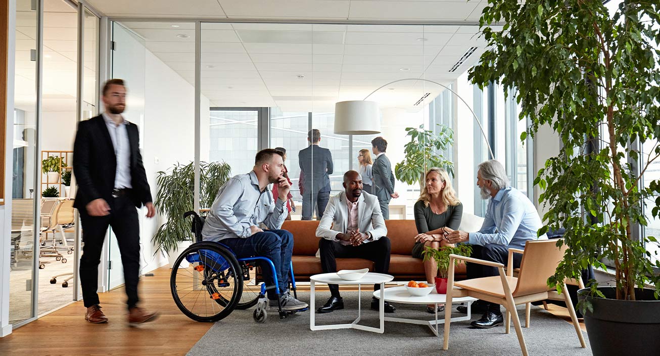 Group of coworkers in a meeting discusses workforce trends