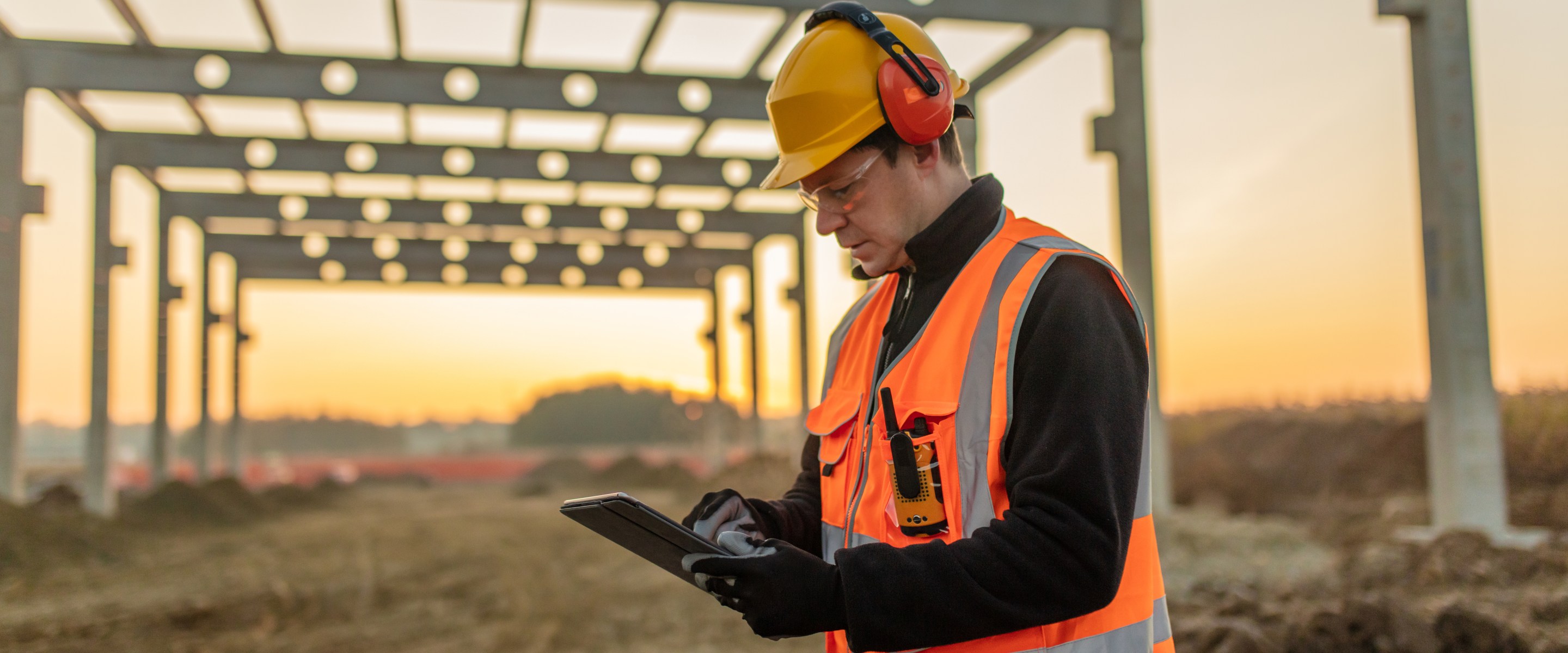 A construction worker, one of the highest paying skill trade jobs, using his table to perform his work duties.