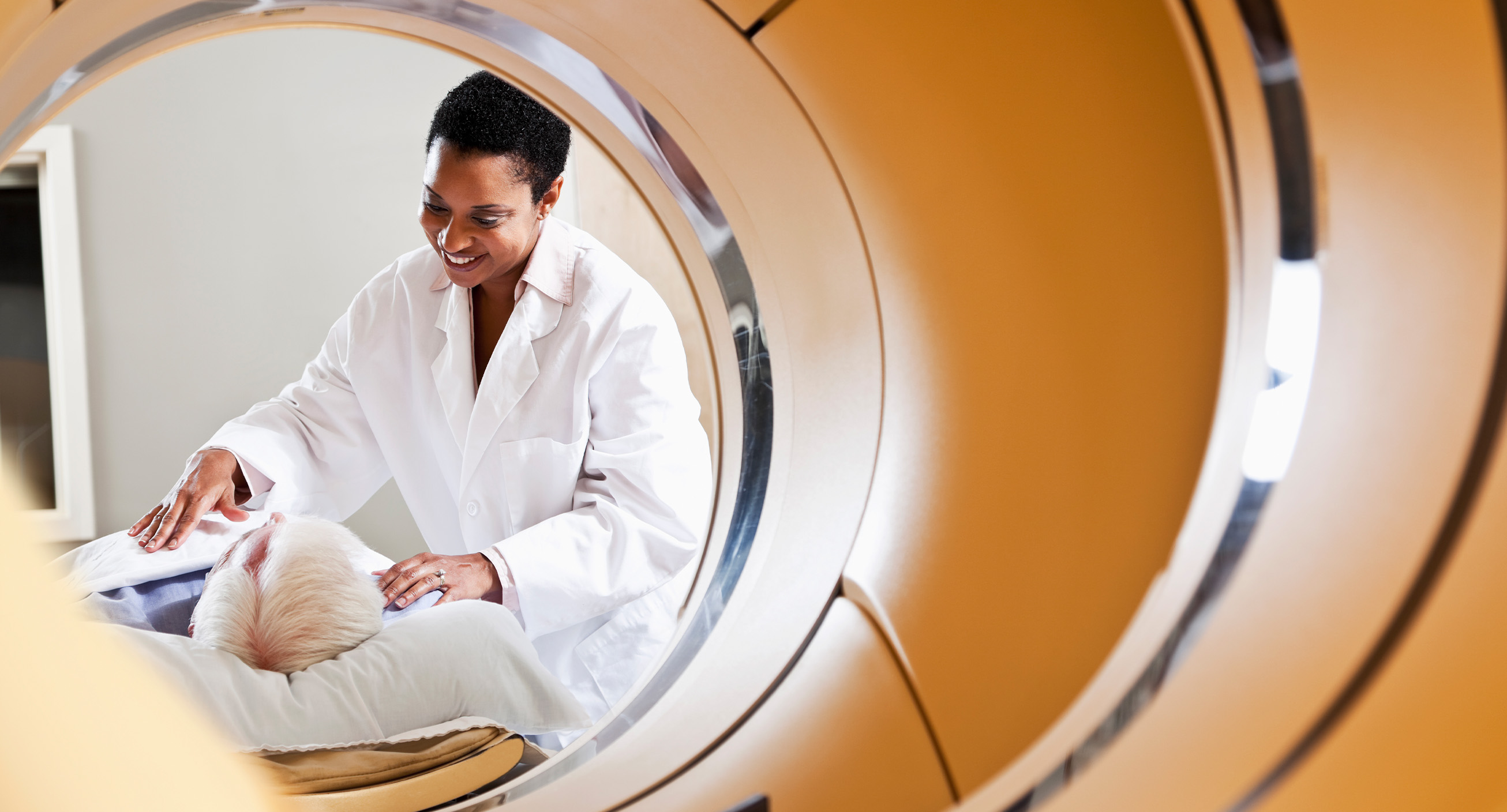 A nuclear medicine technician, one of the highest paying trade jobs, prepares a patient for imaging