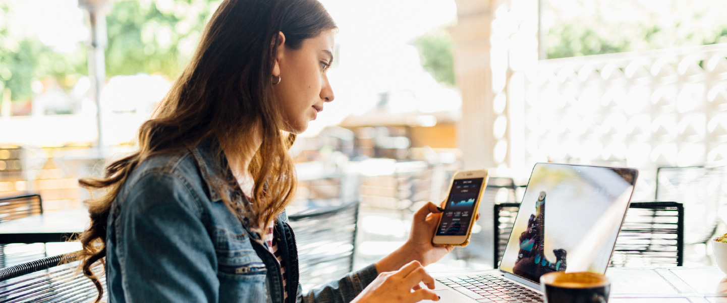 While researching crypto on her phone, a woman asks herself, “how does cryptocurrency work?”