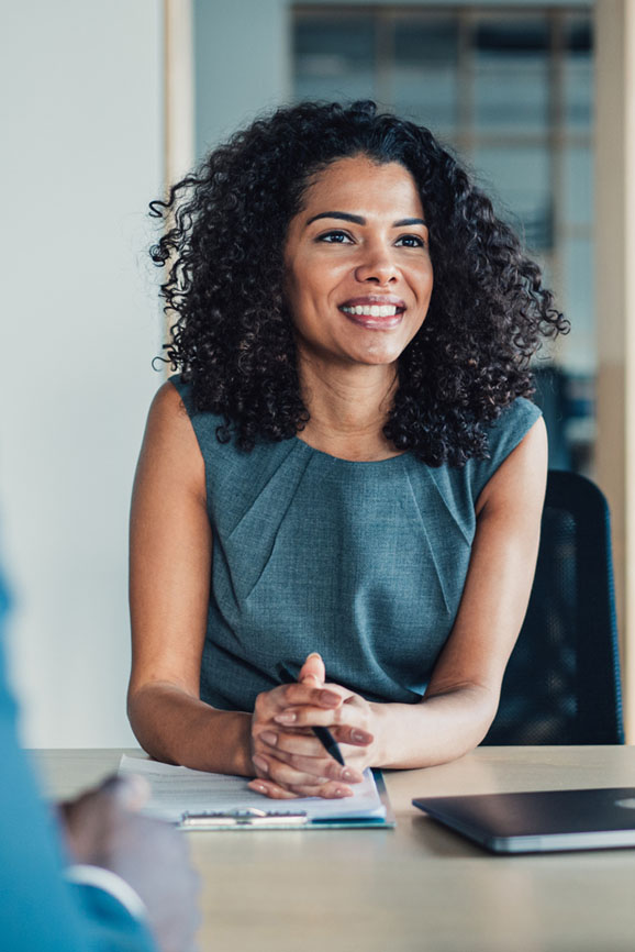 A woman consults financial advisors about ESG investment options.